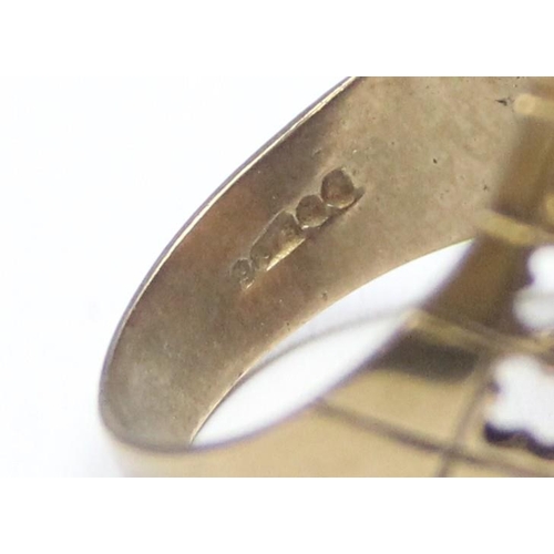 1100 - A large 9ct gold mounted full sovereign ring, the pierced 9ct gold shank set with a 22ct gold 1967 f... 