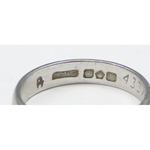 1101 - A vintage platinum band ring with engraved decoration, full hallmarked for Sheffield 1976 and XRF co... 