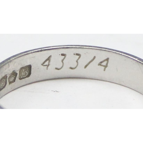 1101 - A vintage platinum band ring with engraved decoration, full hallmarked for Sheffield 1976 and XRF co... 