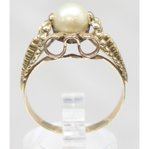 1102 - A large retro 18ct gold and pearl cocktail ring with decorative pierced setting, indistinctly marked... 