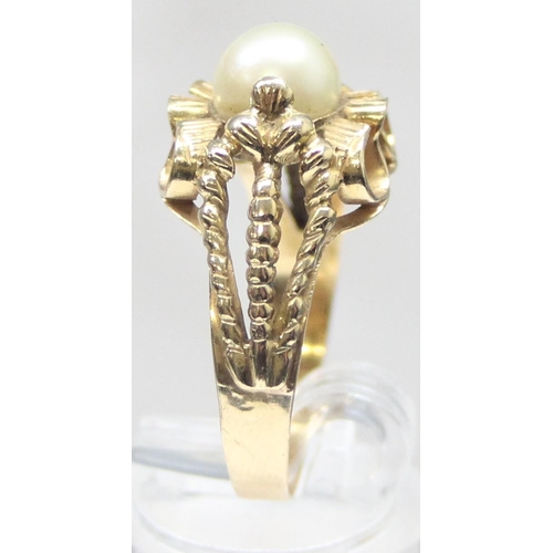 1102 - A large retro 18ct gold and pearl cocktail ring with decorative pierced setting, indistinctly marked... 