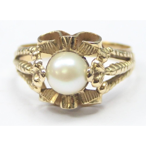 1102 - A large retro 18ct gold and pearl cocktail ring with decorative pierced setting, indistinctly marked... 