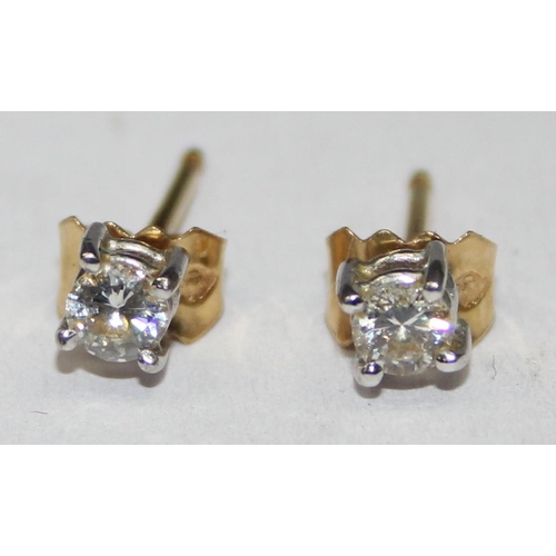 1115 - A pair of 18ct gold diamond stud earrings, indistinctly marked but XRF confirmed to be 18ct gold, ap... 