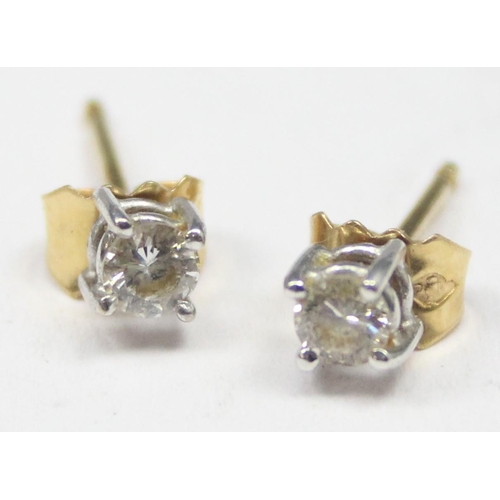 1115 - A pair of 18ct gold diamond stud earrings, indistinctly marked but XRF confirmed to be 18ct gold, ap... 