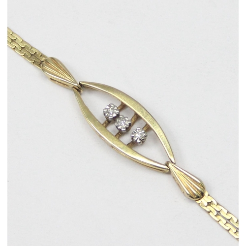 1117 - A retro West German made 9ct gold and diamond set bracelet, a trio of small diamonds flanked by 2 le... 