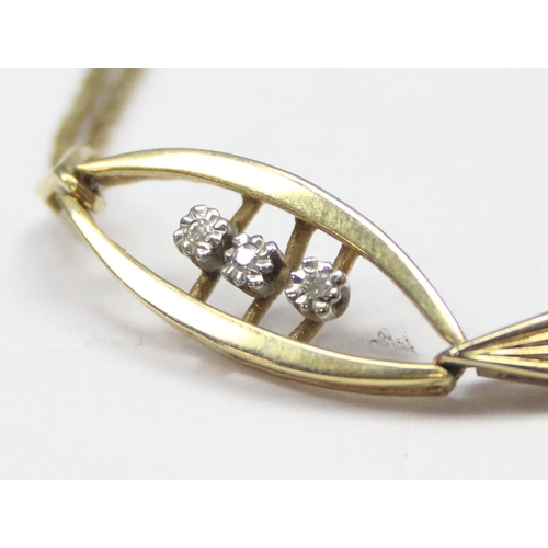 1117 - A retro West German made 9ct gold and diamond set bracelet, a trio of small diamonds flanked by 2 le... 