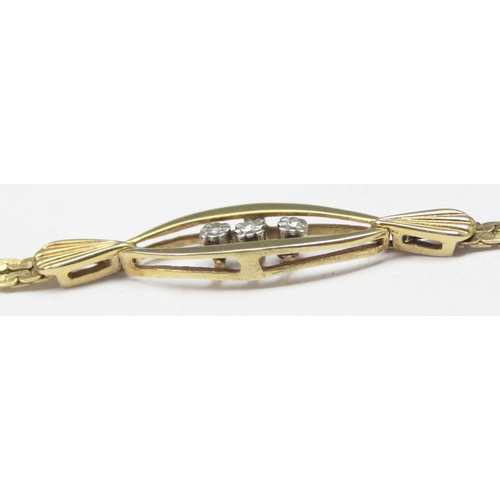 1117 - A retro West German made 9ct gold and diamond set bracelet, a trio of small diamonds flanked by 2 le... 