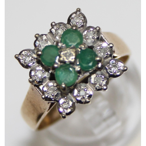 1118 - A diamond and emerald set cocktail ring of retro style, 4 square set emeralds with a small central d... 