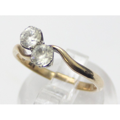 1119 - 9ct gold 2 stone diamond ring in crossover setting, marked 9ct and XRF confirmed, approx size L, app... 