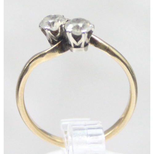 1119 - 9ct gold 2 stone diamond ring in crossover setting, marked 9ct and XRF confirmed, approx size L, app... 