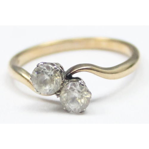 1119 - 9ct gold 2 stone diamond ring in crossover setting, marked 9ct and XRF confirmed, approx size L, app... 