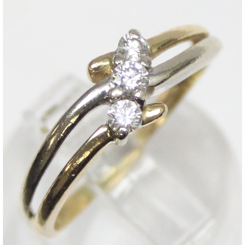 1130 - An 18ct gold and 3 stone diamond ring in angled setting, marked 750 and XRF confirmed, approx size N... 