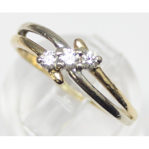 1130 - An 18ct gold and 3 stone diamond ring in angled setting, marked 750 and XRF confirmed, approx size N... 