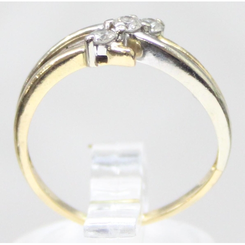 1130 - An 18ct gold and 3 stone diamond ring in angled setting, marked 750 and XRF confirmed, approx size N... 