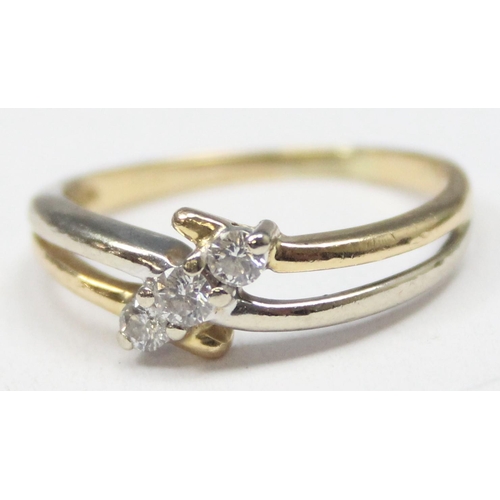 1130 - An 18ct gold and 3 stone diamond ring in angled setting, marked 750 and XRF confirmed, approx size N... 