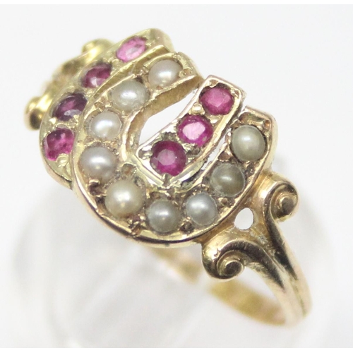 1131 - A Victorian 15ct gold double horseshoe ring, one set with seed pearls, the other with rubies, marked... 