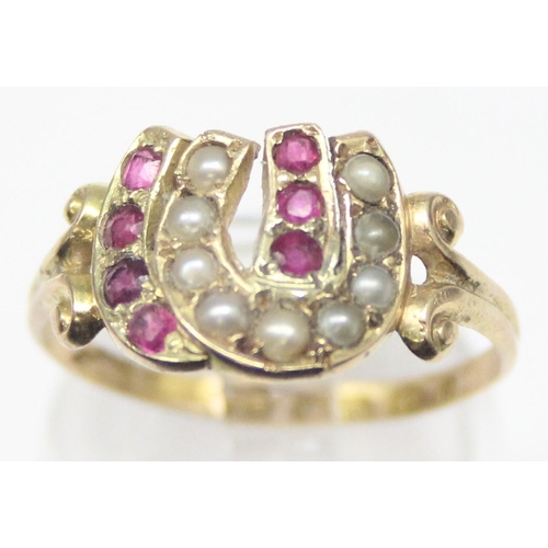 1131 - A Victorian 15ct gold double horseshoe ring, one set with seed pearls, the other with rubies, marked... 