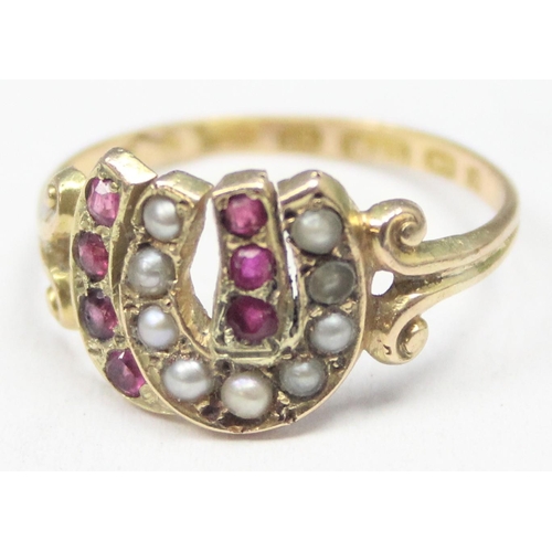 1131 - A Victorian 15ct gold double horseshoe ring, one set with seed pearls, the other with rubies, marked... 