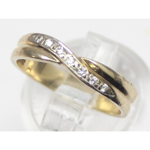 1133 - 9ct gold diamond ring in crossover setting, indistinctly marked but XRF confirmed as 9ct gold, appro... 