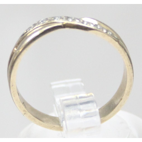 1133 - 9ct gold diamond ring in crossover setting, indistinctly marked but XRF confirmed as 9ct gold, appro... 