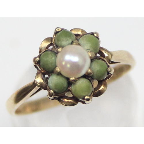 1134 - An unusual 9ct gold floral cluster ring set with a central pearl surrounded by 6 matte green stone b... 