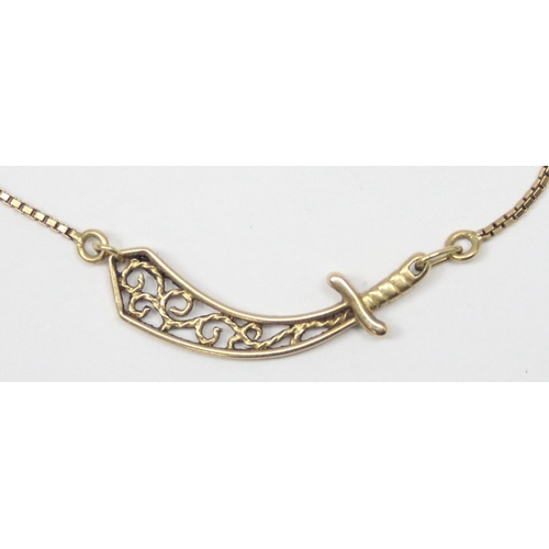 1143 - An unusual 18ct gold pendant necklace set with a filigree pendant formed as a scimitar sword on fine... 