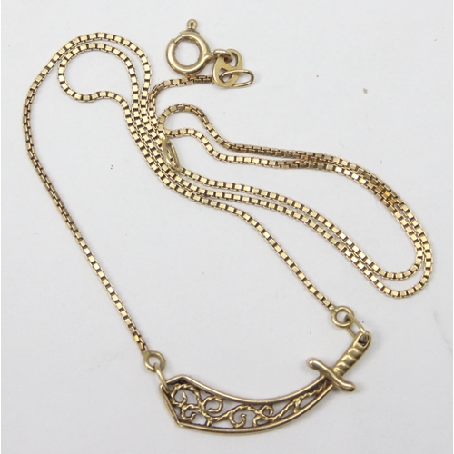 1143 - An unusual 18ct gold pendant necklace set with a filigree pendant formed as a scimitar sword on fine... 