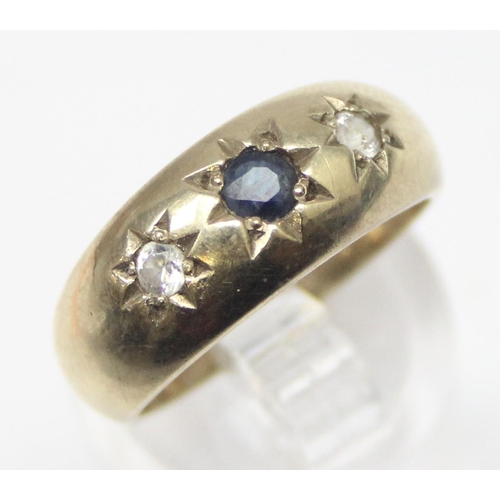 1149 - An antique style 9ct gold 3 stone gypsy set ring, a larger central sapphire flanked by 2 white stone... 