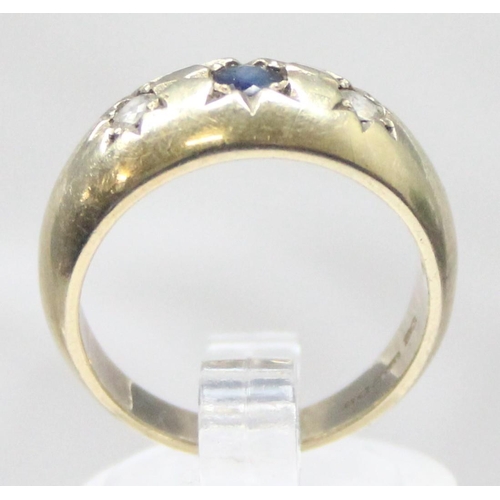 1149 - An antique style 9ct gold 3 stone gypsy set ring, a larger central sapphire flanked by 2 white stone... 