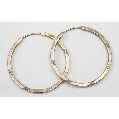 1159 - A pair of 9ct gold hoop earrings, seemingly unmarked but XRF confirmed, approx 25mm in diameter, app... 