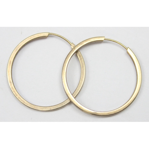 1159 - A pair of 9ct gold hoop earrings, seemingly unmarked but XRF confirmed, approx 25mm in diameter, app... 