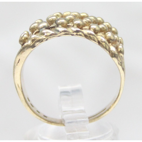 1163 - A vintage 9ct gold keeper ring of woven design, marked for London 1995, approx size T, approx 10.24g... 