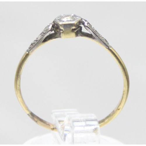 1168 - An 18ct gold and platinum set solitaire diamond ring with diamond set shoulders, approx size Q, appr... 