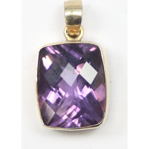 1169 - A 9ct gold mounted pendant with facet cut purple stone, marked and XRF confirmed, approx 1.56g gross