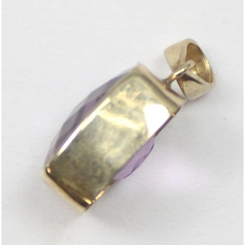 1169 - A 9ct gold mounted pendant with facet cut purple stone, marked and XRF confirmed, approx 1.56g gross