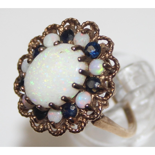 1172 - A large 9ct gold opal and sapphire cluster ring, marked for London 1972 and XRF confirmed, approx si... 