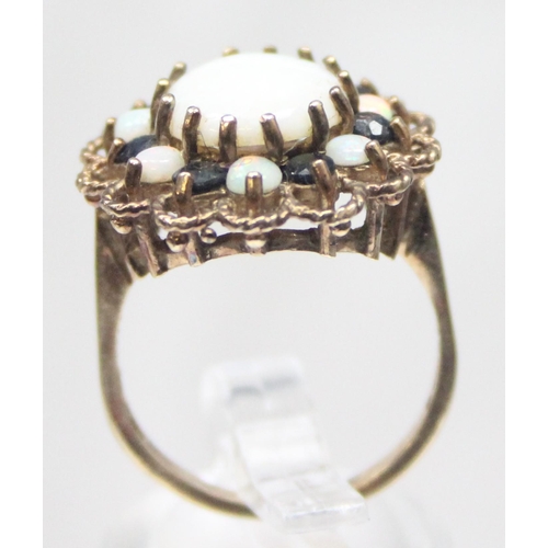 1172 - A large 9ct gold opal and sapphire cluster ring, marked for London 1972 and XRF confirmed, approx si... 