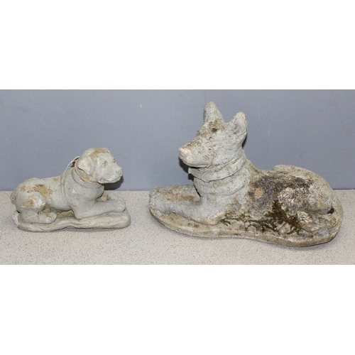 316 - 2 concrete garden dog figures, the largest approx 40cm wide