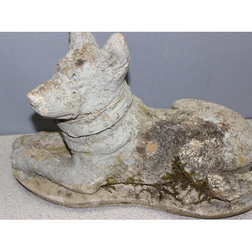 316 - 2 concrete garden dog figures, the largest approx 40cm wide