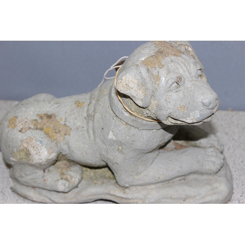 316 - 2 concrete garden dog figures, the largest approx 40cm wide