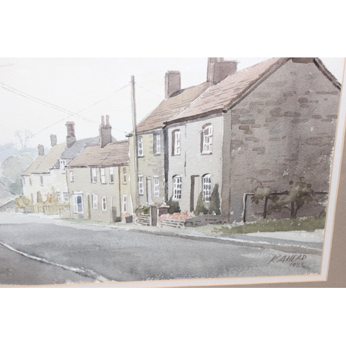 423 - Original watercolour of a street scene in frame, dated 1985 signed K A Head, approx 75cm x 57cm