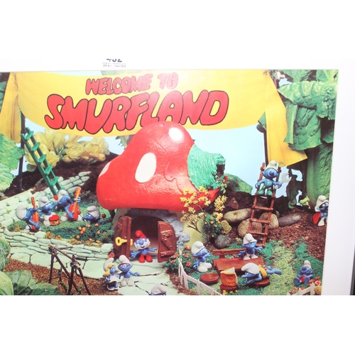 432 - Welcome To Smurfland framed photographic print, approx 83cm x 63cm