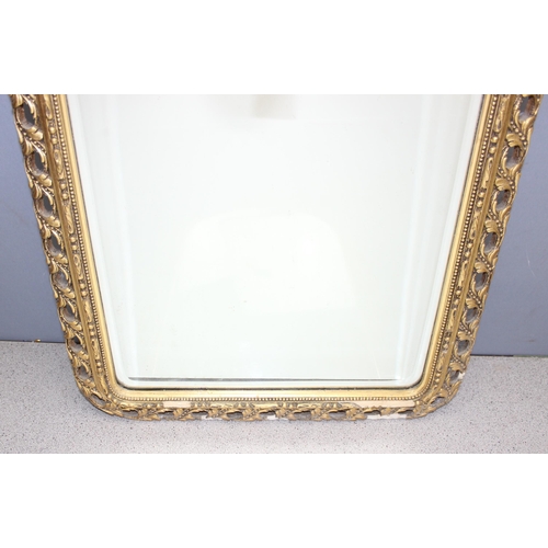 434 - Ornate gilt framed done-topped mirror, approx 86cm x 48cm