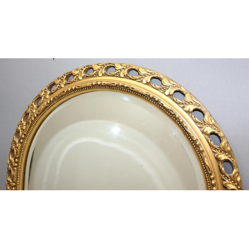 434 - Ornate gilt framed done-topped mirror, approx 86cm x 48cm