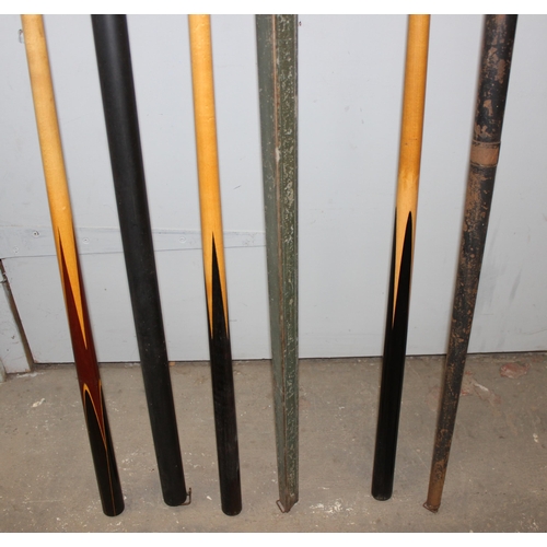 702 - 3 vintage snooker cues in long metal club cases