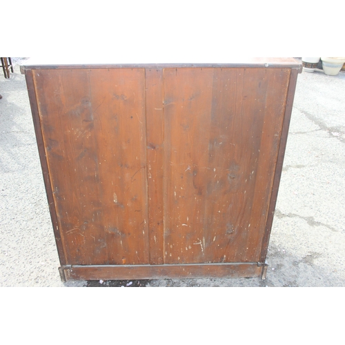 154 - An antique 2 over 3 chest of drawers with brass handles, approx 119cm wide x 54cm deep x 116cm tall