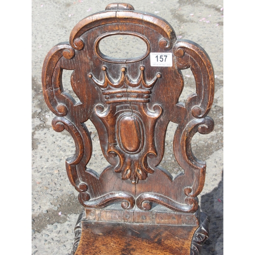 157 - An antique carved oak hall chair with barleytwist legs, approx 85cm tall