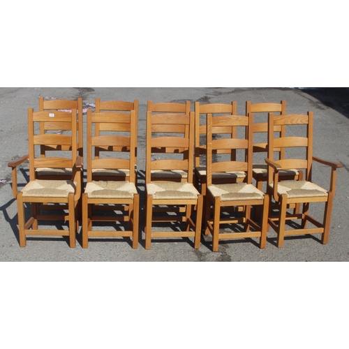 162 - A set of 10 Arts & Crafts style light oak rush seated dining chairs, each approx 109cm tall