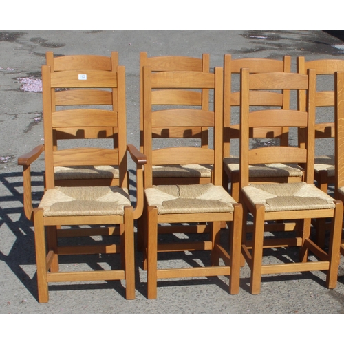 162 - A set of 10 Arts & Crafts style light oak rush seated dining chairs, each approx 109cm tall