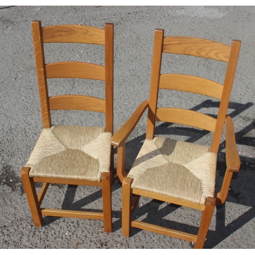 162 - A set of 10 Arts & Crafts style light oak rush seated dining chairs, each approx 109cm tall